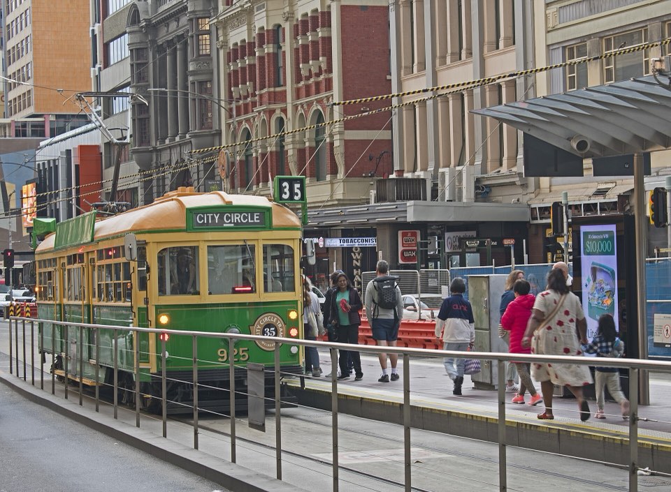 A Melbourne tram on Swanston Street beside the Flinders Street stop